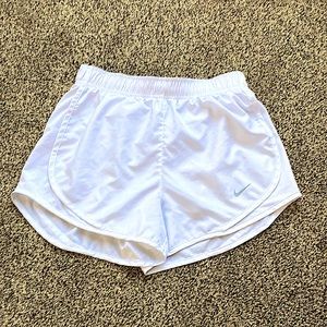 These are white Nike shorts. The size is in women’s and it’s a small.